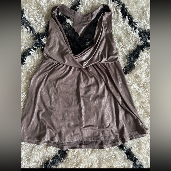 A shirt bundle with 5 tops (sizes include 1- XS, 3- smalls, and 1- medium) - Picture 10 of 11